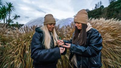 Teachers writing and dressed warmly outside at the Eden Project